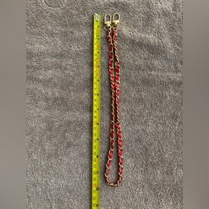 Gold with red pleather chain brand new